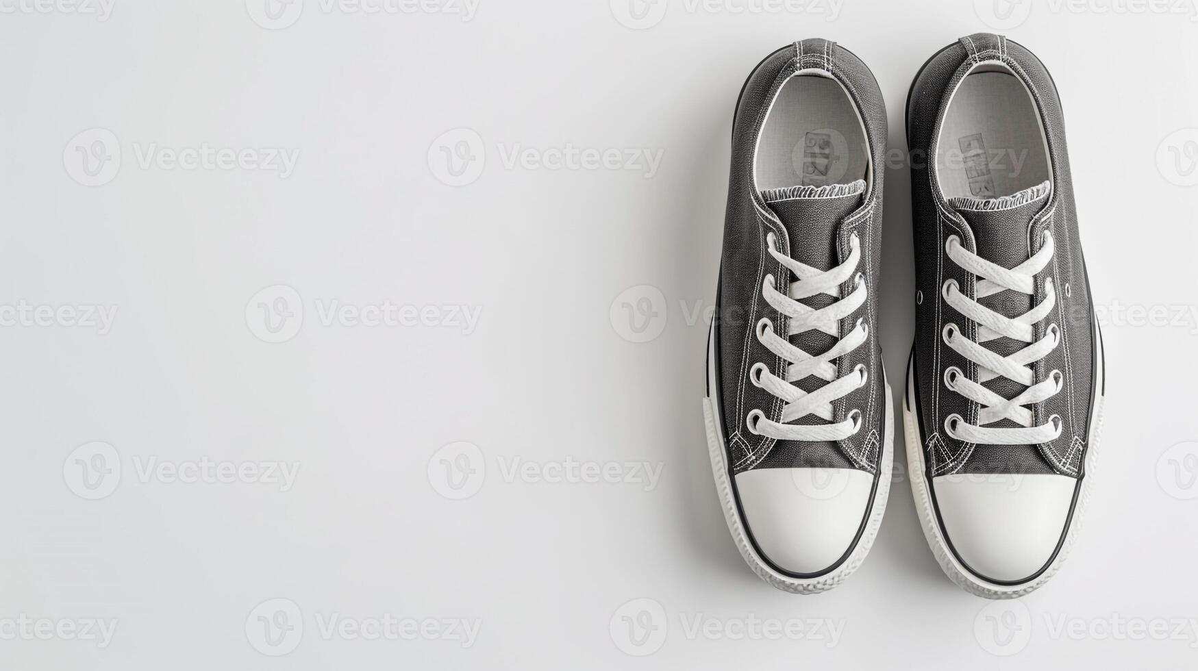 AI generated Charcoal canvas shoes isolated on flat white background with copy space for advertisement. Generative AI photo