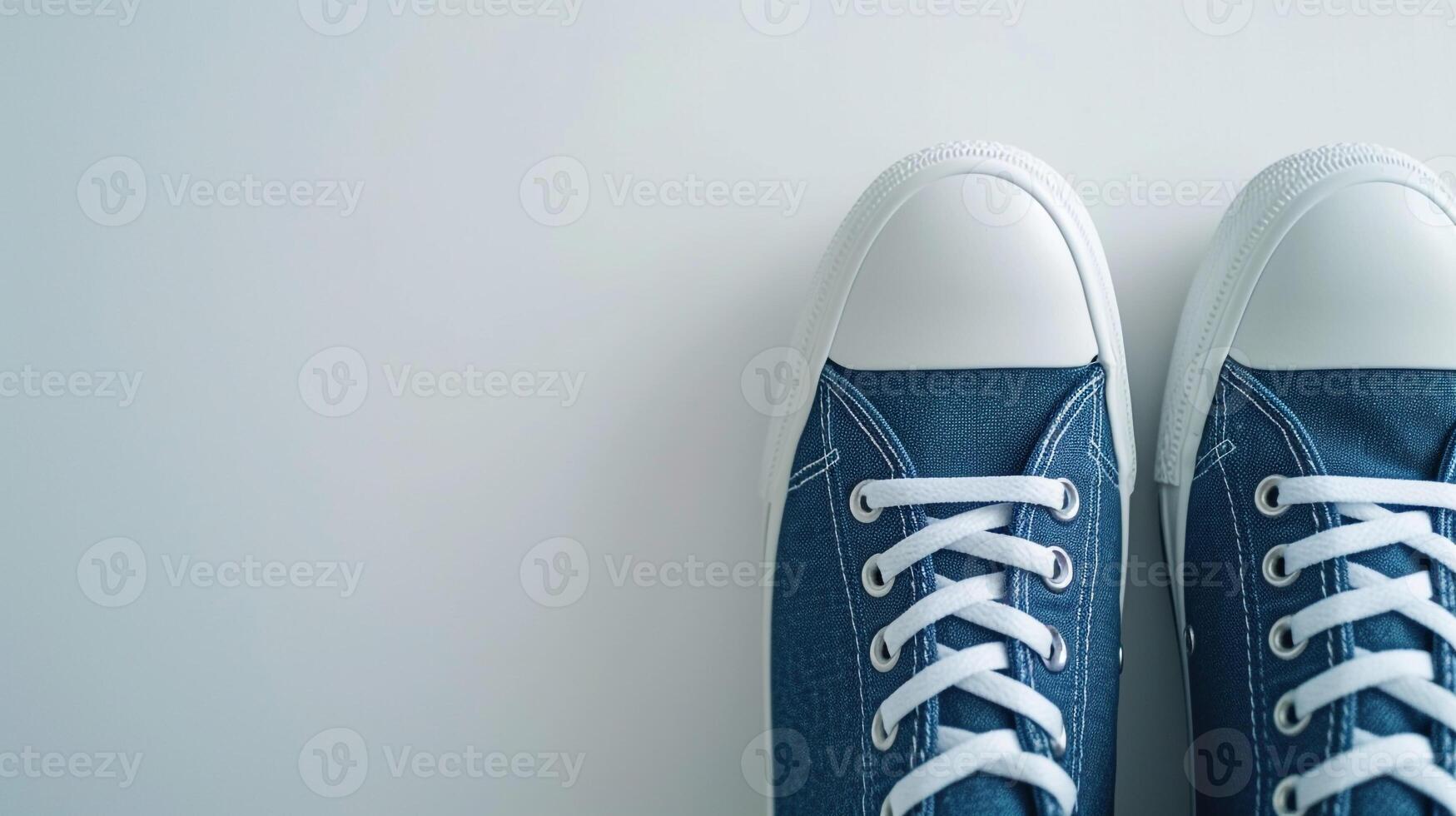 AI generated Indigo canvas shoes isolated on flat white background with copy space for advertisement. Generative AI photo