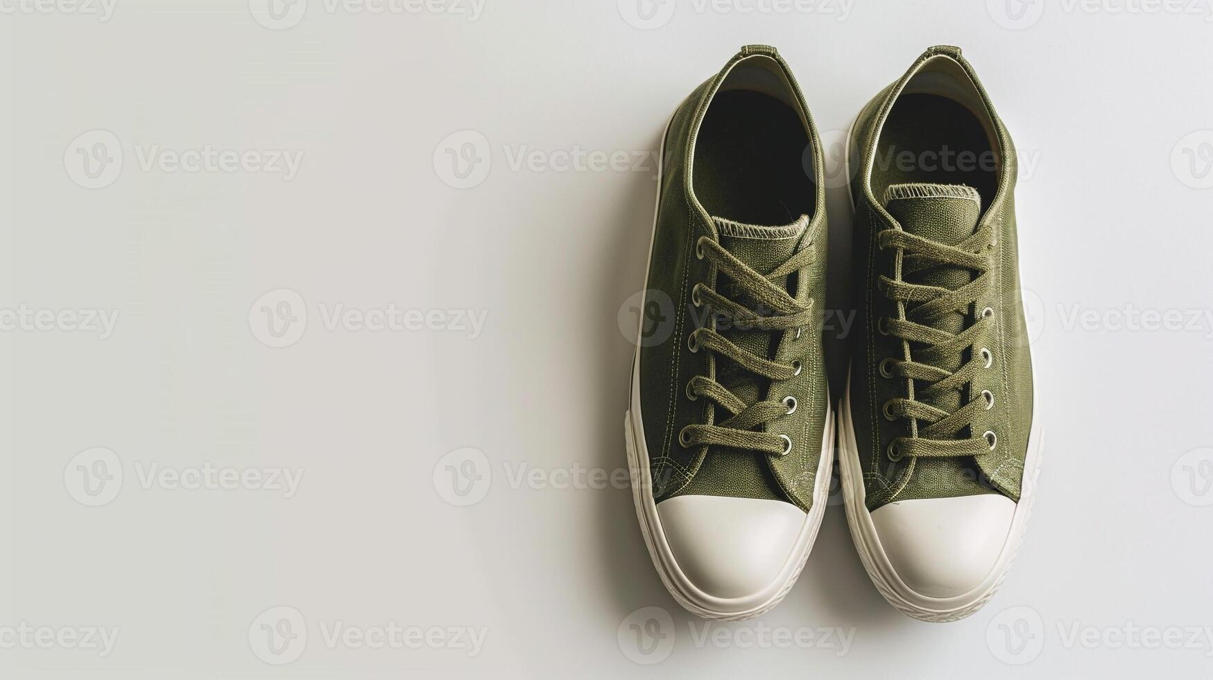 AI generated Olive canvas shoes isolated on flat white background with copy space for advertisement. Generative AI photo