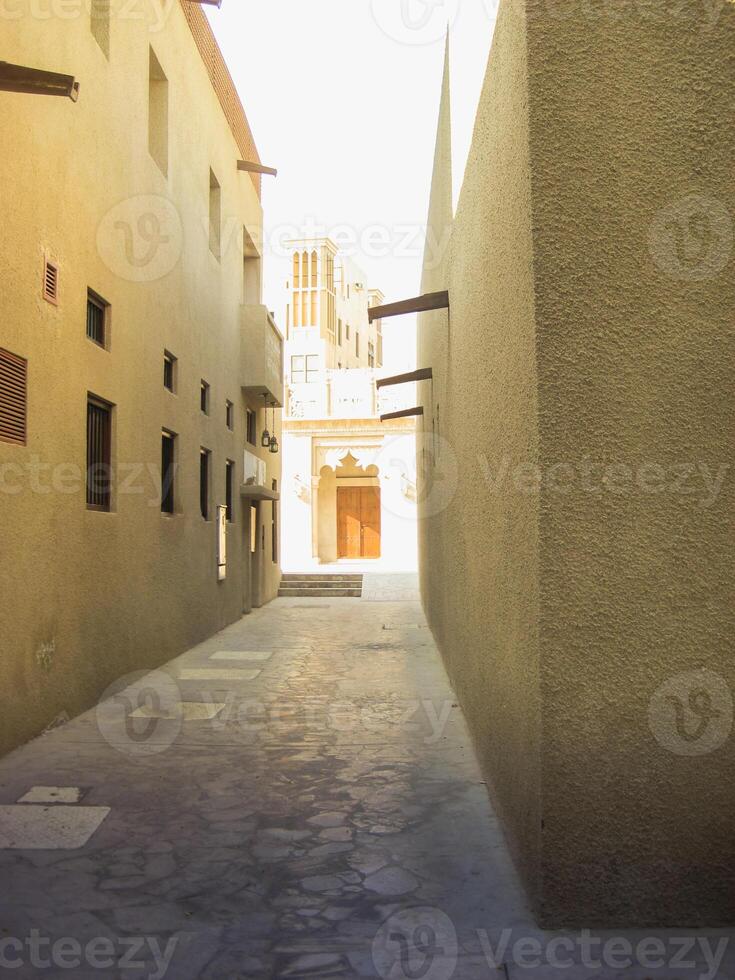 A walkway with beautiful contrasts of light and shadow creates a feeling of conflict and harmony at the same time. photo