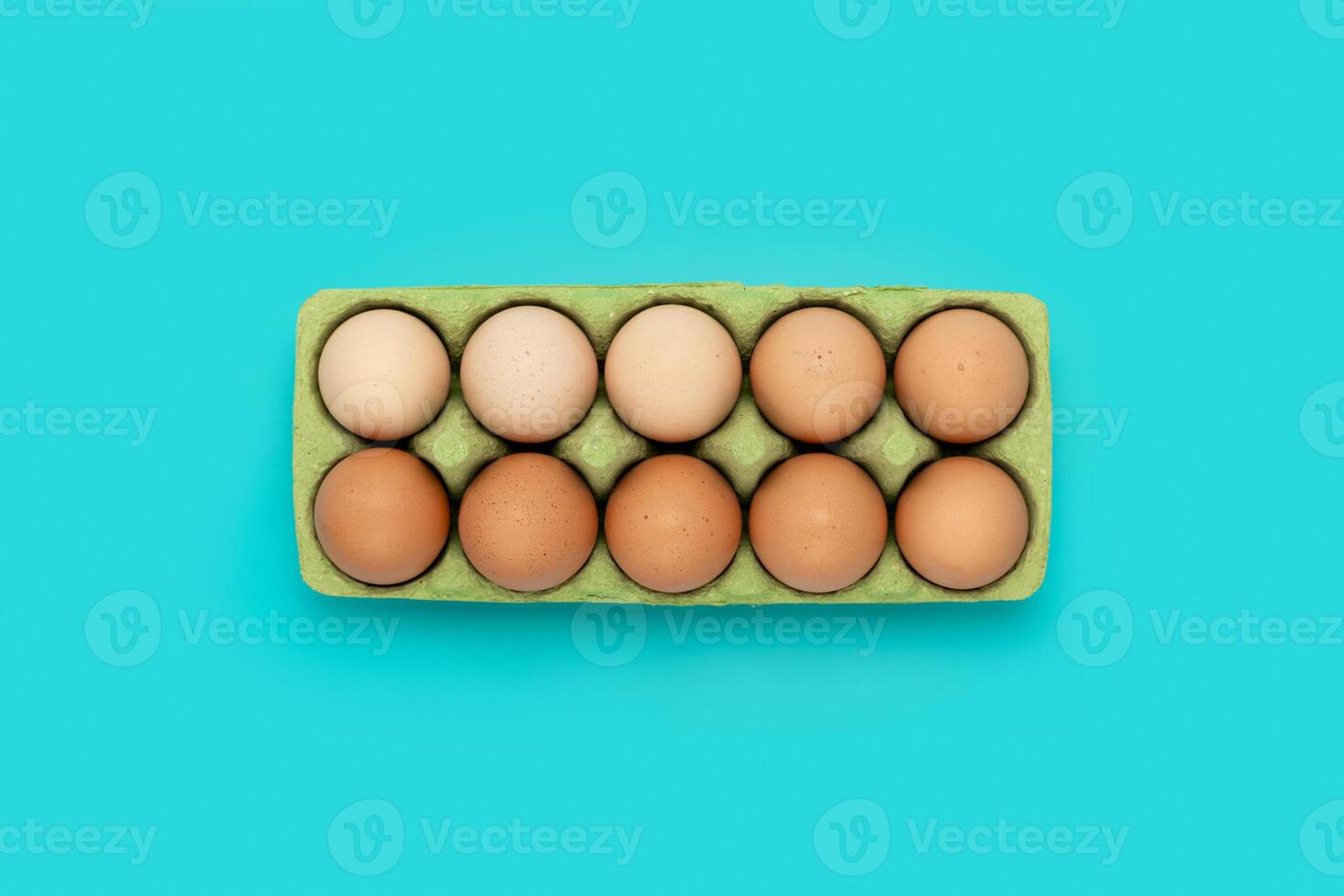 Green carton of different eggs. Easter background photo