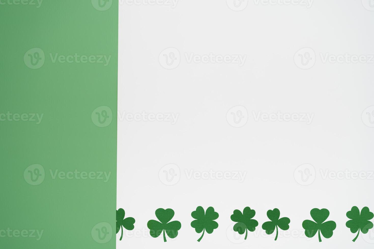 Green and white background with clover shamrock photo