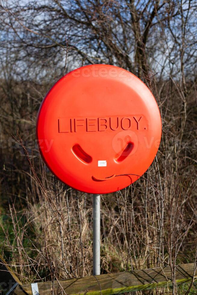 Life Buoy on a post in the park photo