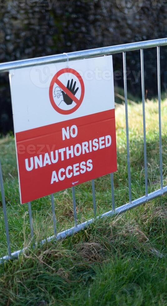 No Unauthorised Access Sign on a metal fence photo