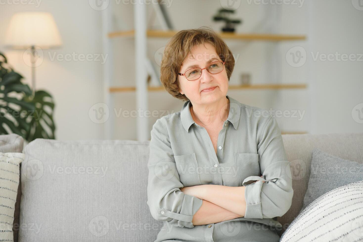 Portrait of smiling mature woman in empty room stock photo