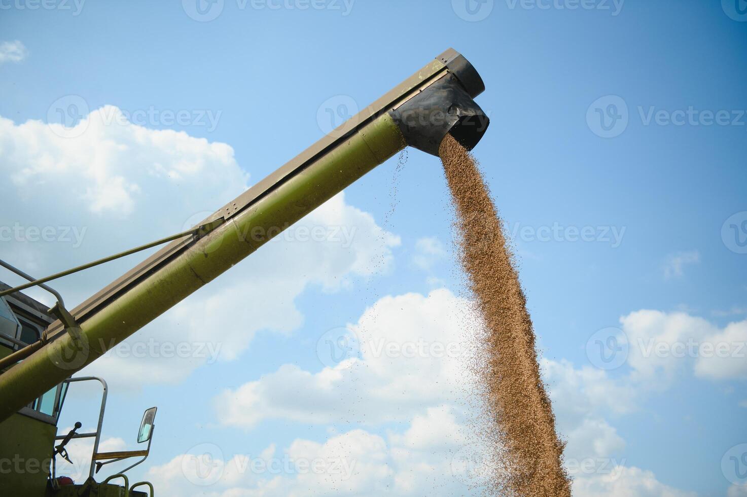 Combine harvester harvests ripe wheat. agriculture photo