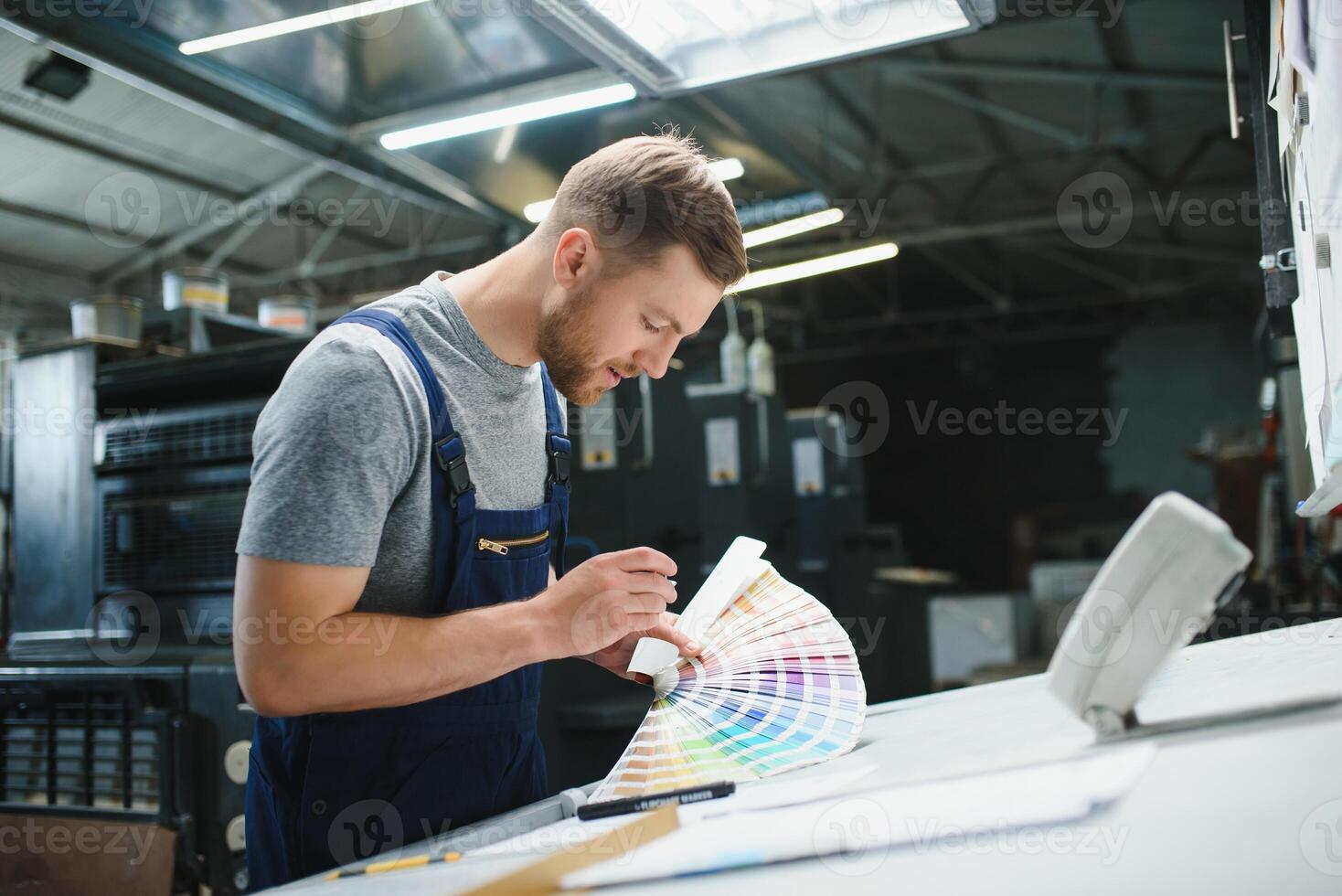 worker in factory on the machine photo