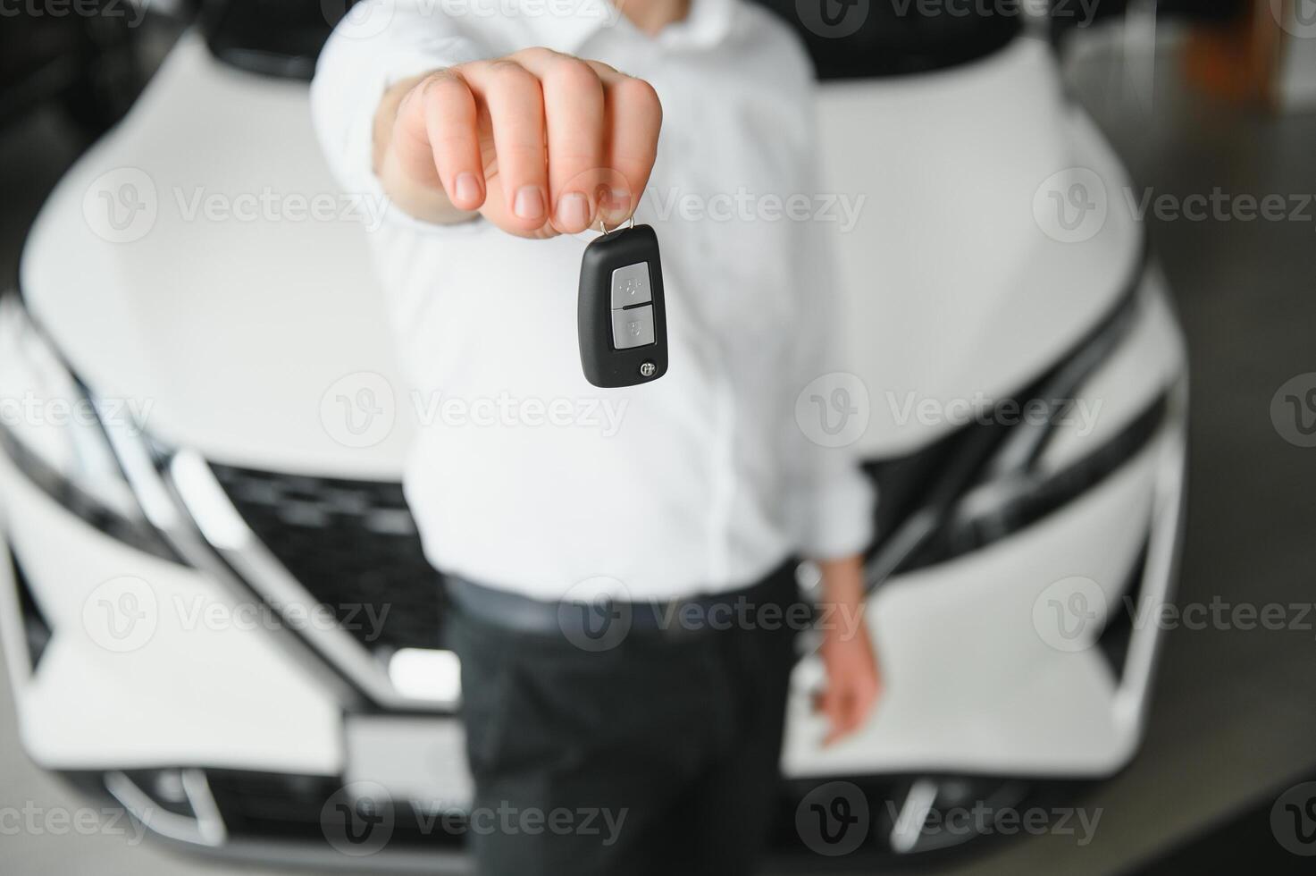 Man buying a car at a showroom photo