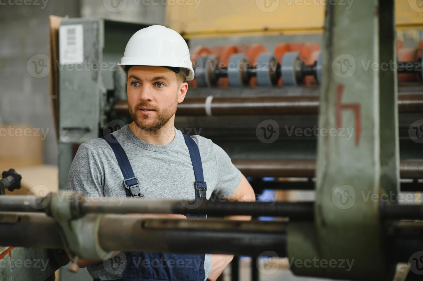 worker in factory on the machine photo