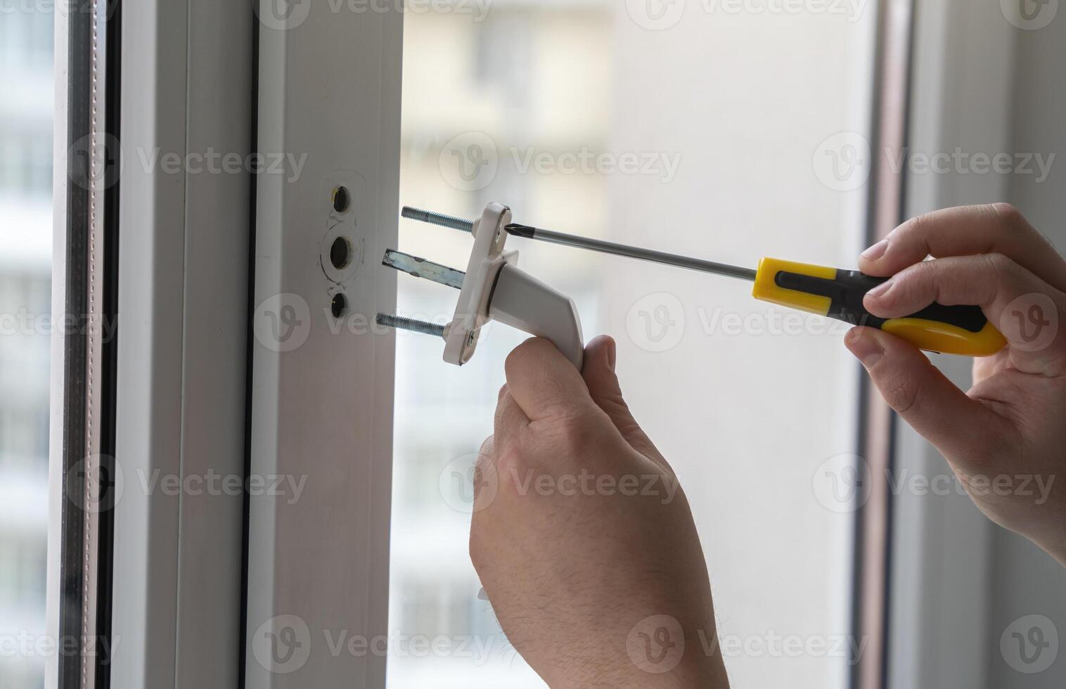 Removing or installing the handle on the window. Protection against accidental opening by small children. Maintenance of window frames. Small housework. Husband for an hour. photo