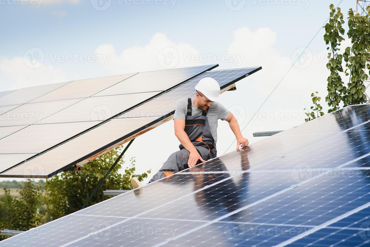 A man working at solar power station. photo