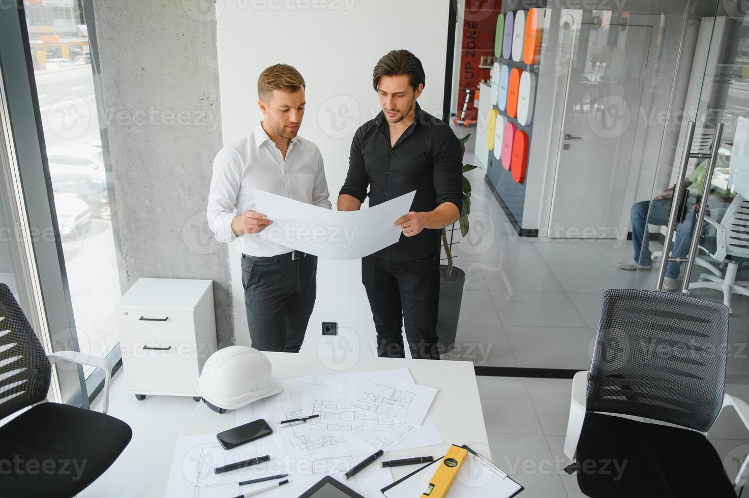 Architect concept, Architects working with blueprints in the office photo