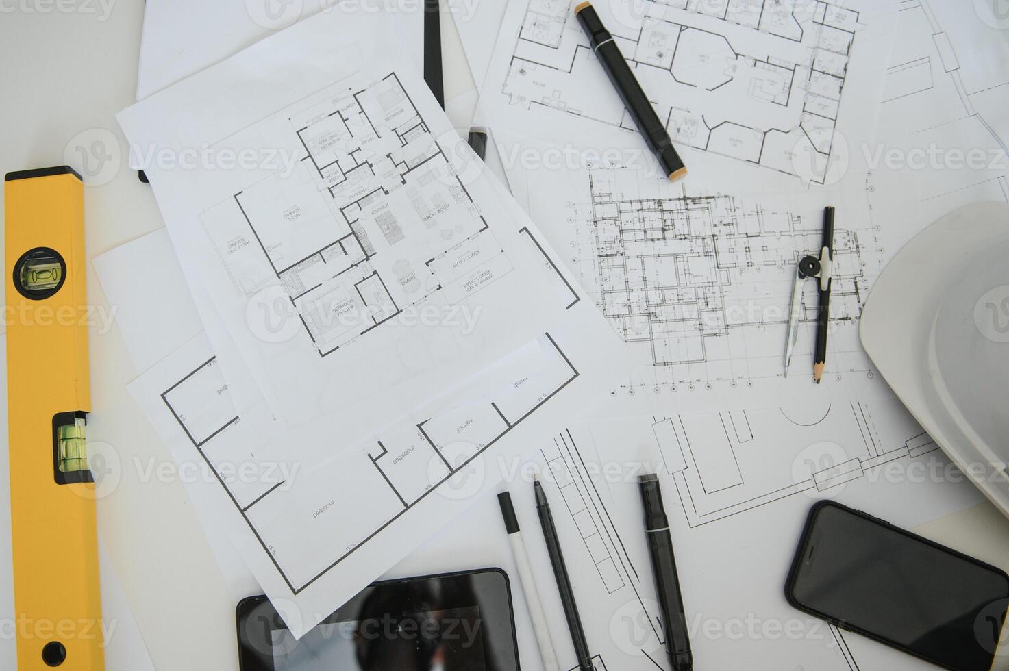 architect design working drawing sketch plans blueprints and making architectural construction model in architect studio,flat lay. photo