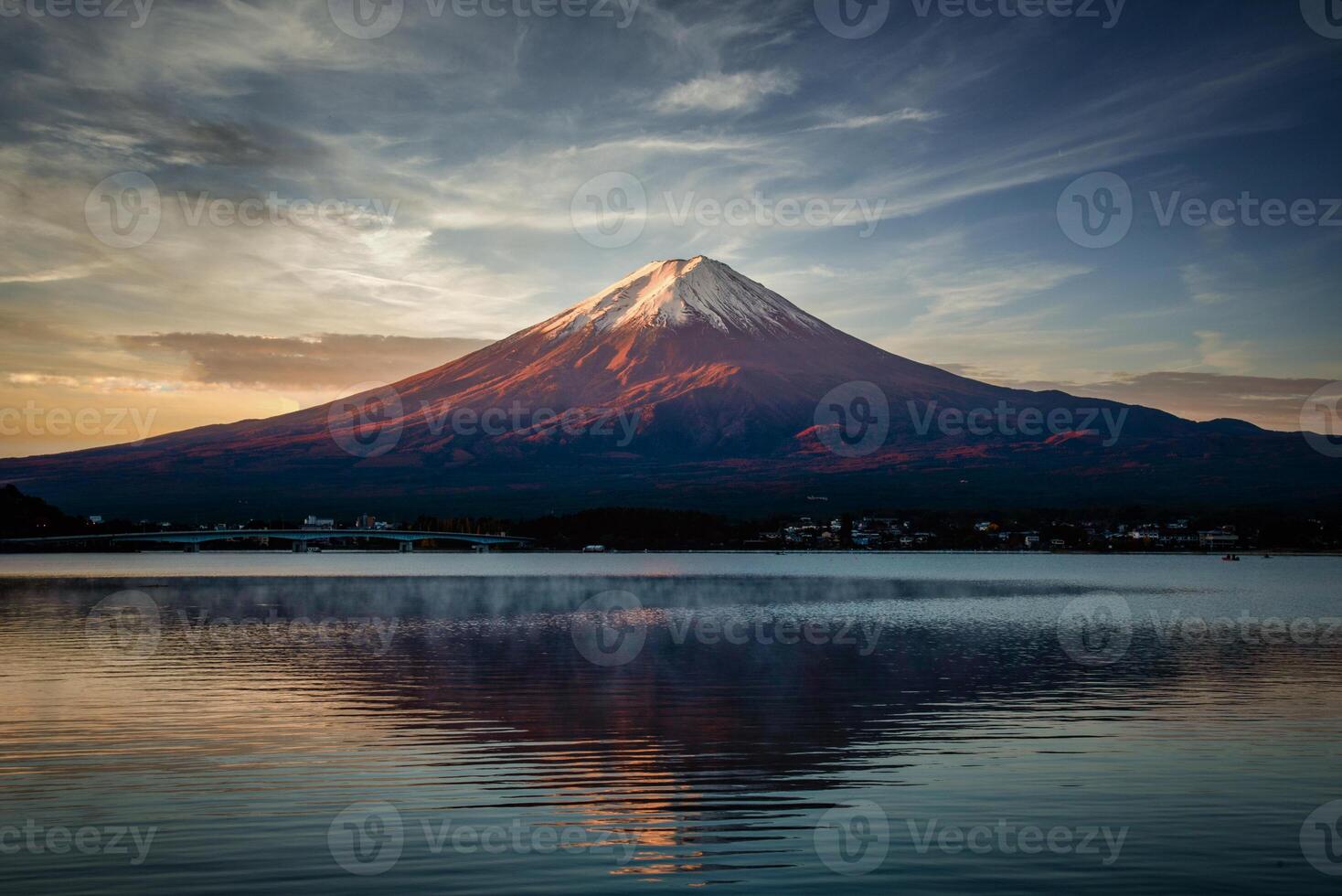 Landscape image of Mt. Fuji over Lake Kawaguchiko at sunrise in Fujikawaguchiko, Japan. photo