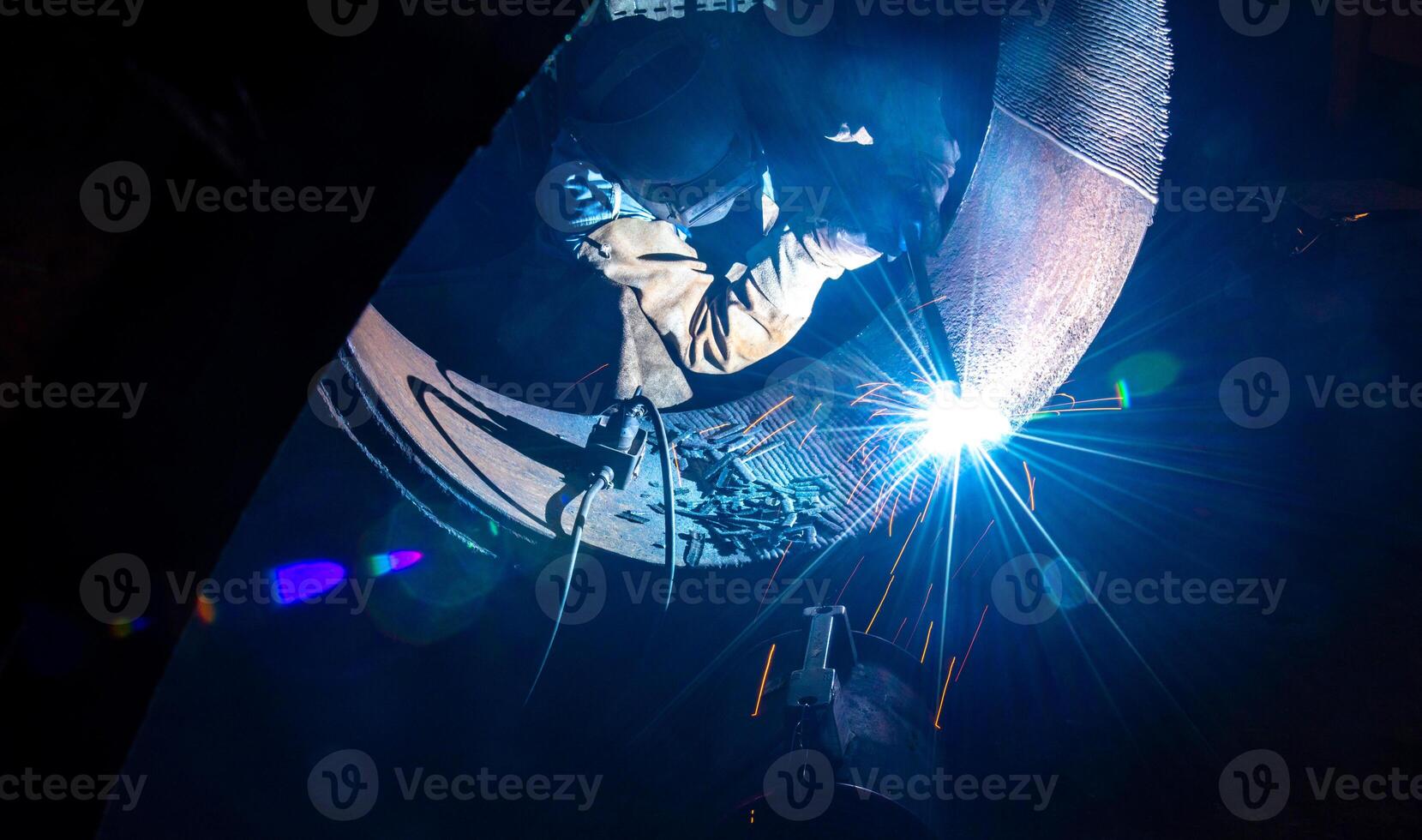 Welding steel structures and bright sparks in steel construction industry. photo