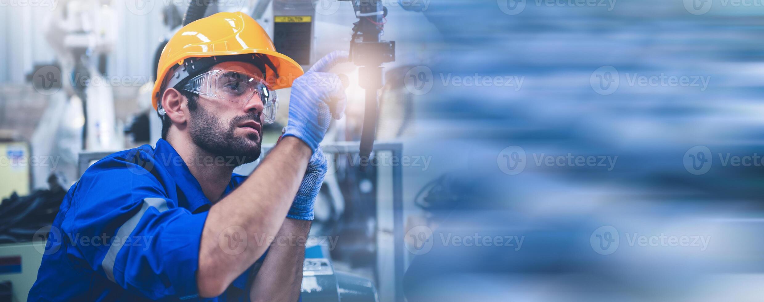 Engineers mechanic using computer controller Robotic arm for welding steel in steel factory workshop. Industry robot programming software for automated manufacturing technology. photo