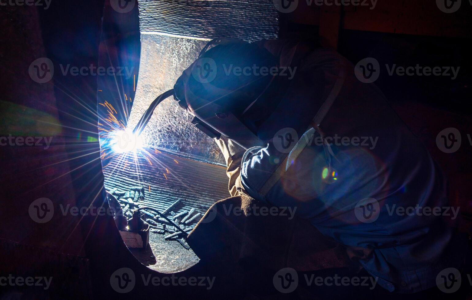 Welding steel structures and bright sparks in steel construction industry. photo