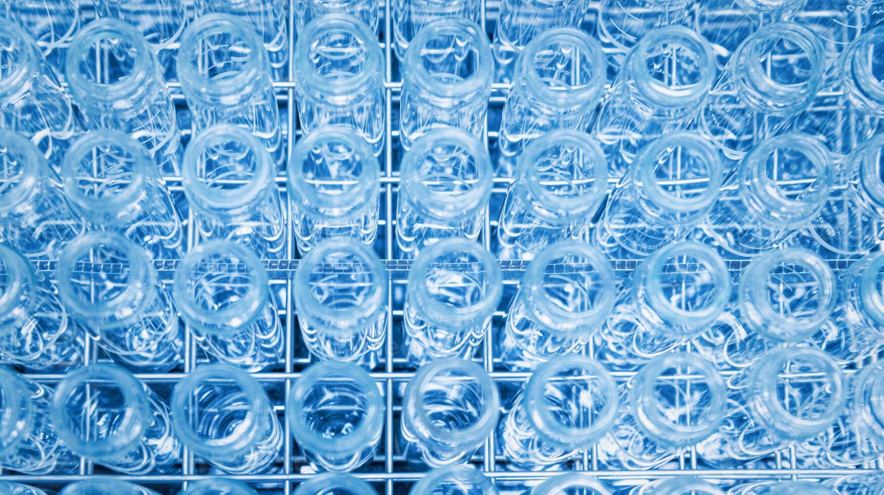 Glass flask with liquid in laboratory. Blue tone. Selective focus. photo