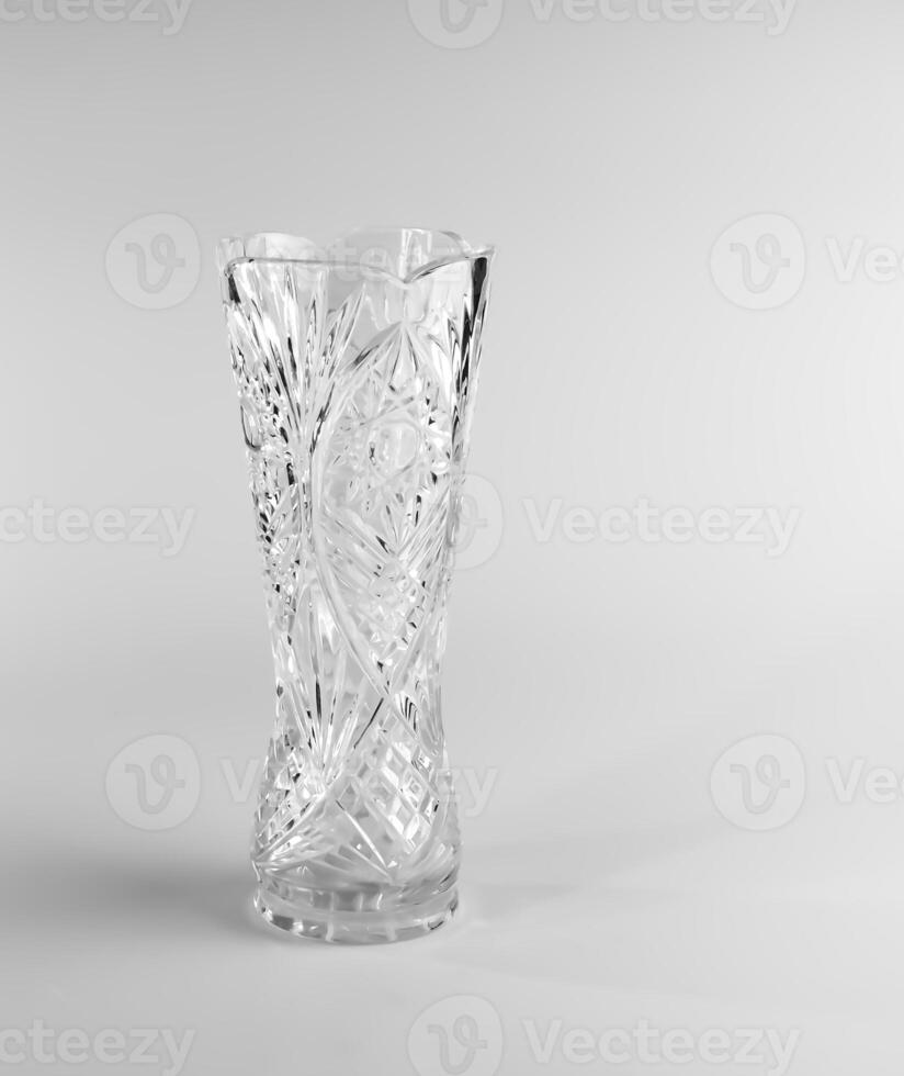 Empty crystal vase on white background. The vase was made in the mid-20th century. photo