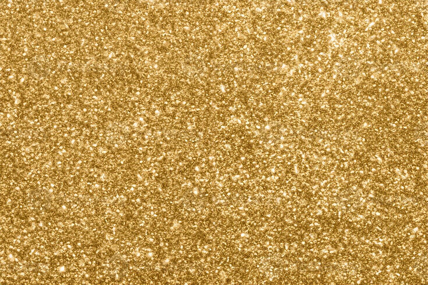 Abstract blur gold glitter sparkle defocused bokeh light background photo