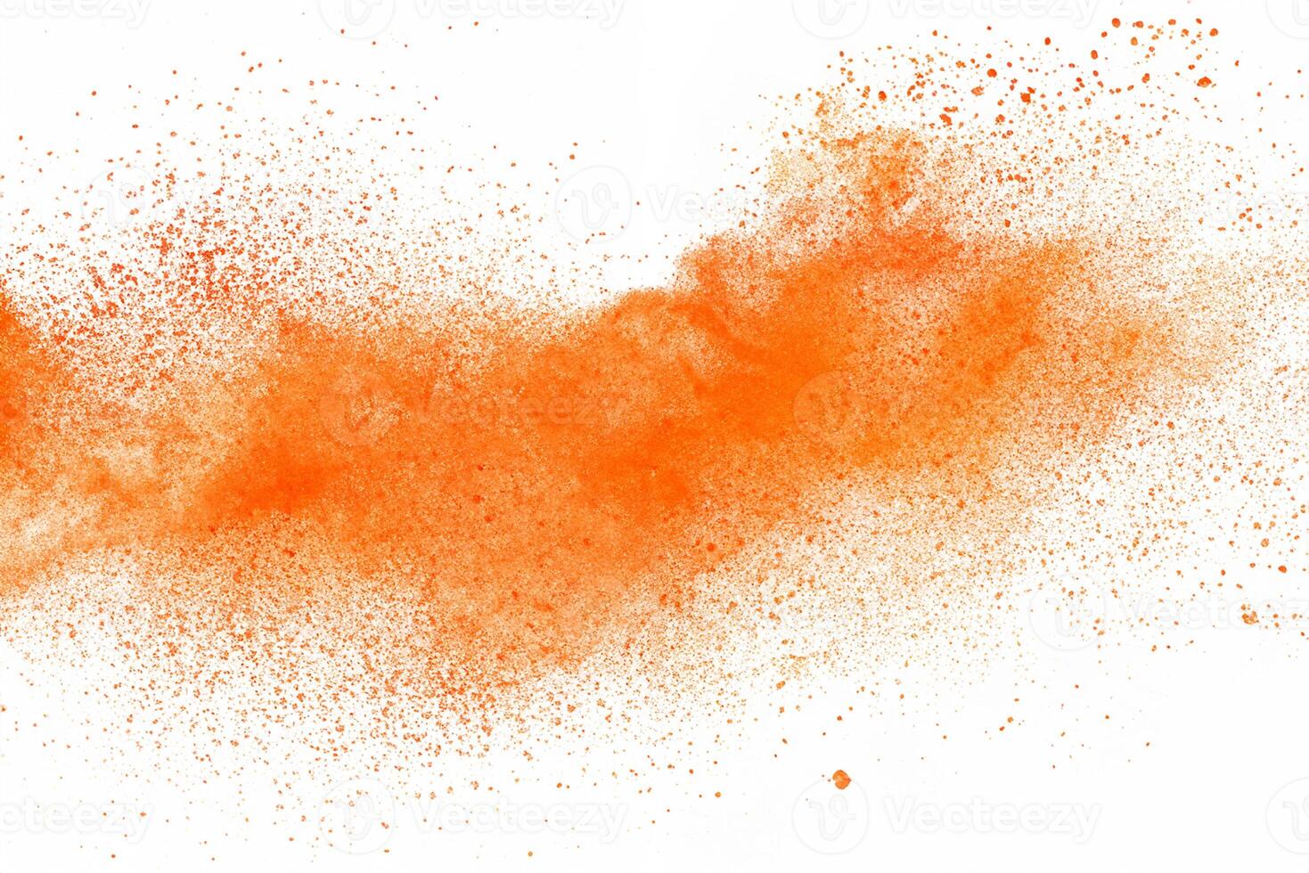Abstract orange powder explosion. Closeup of orange dust particle splash isolated on white background photo