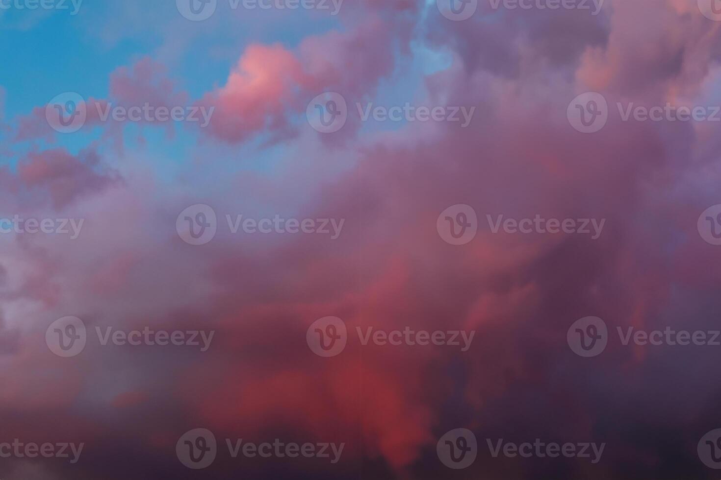 Dramatic sky with bright red and dark blue stormy clouds. Nature background photo