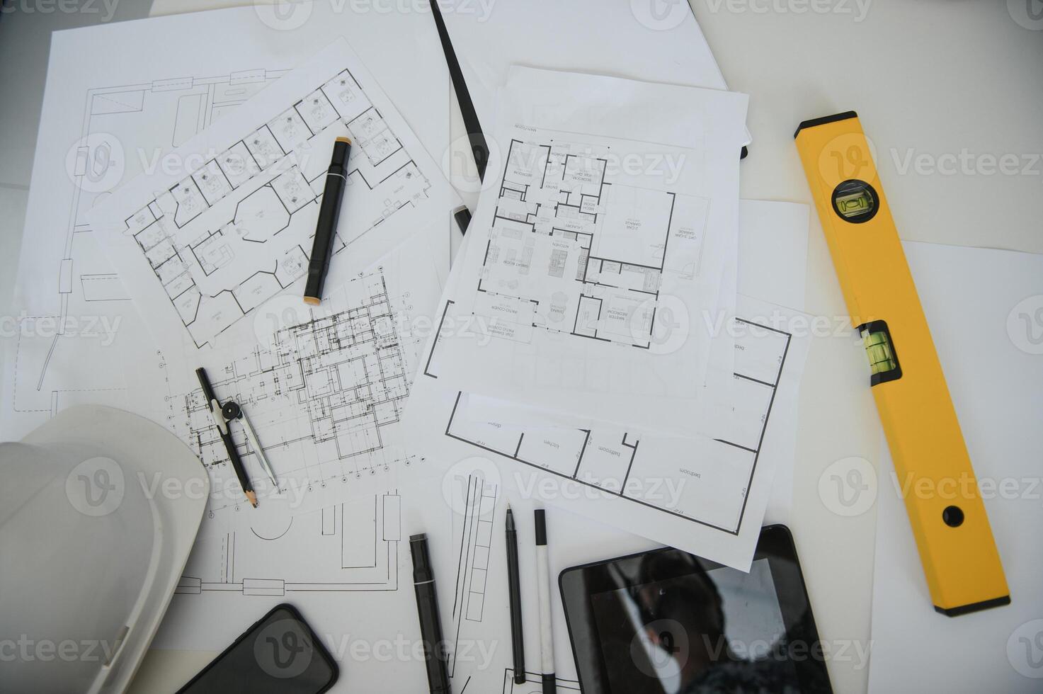 architect design working drawing sketch plans blueprints and making architectural construction model in architect studio,flat lay. photo