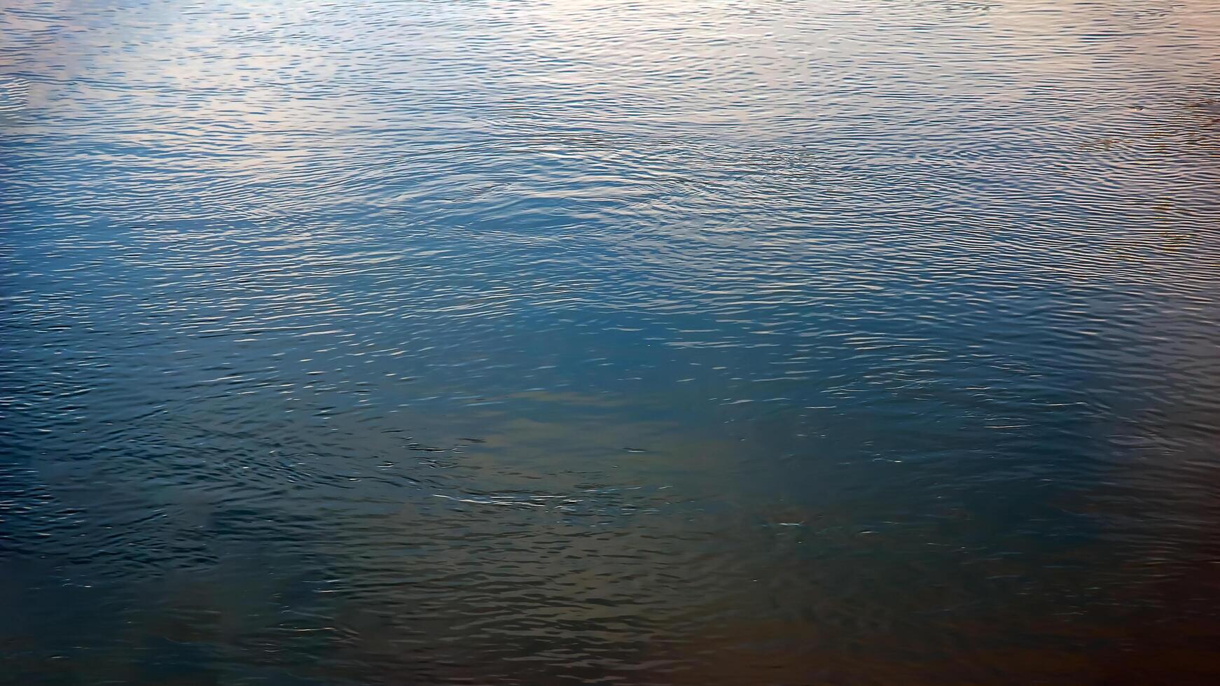 Background of the water surface of the Salzach river. Texture of water of a mountain river. photo