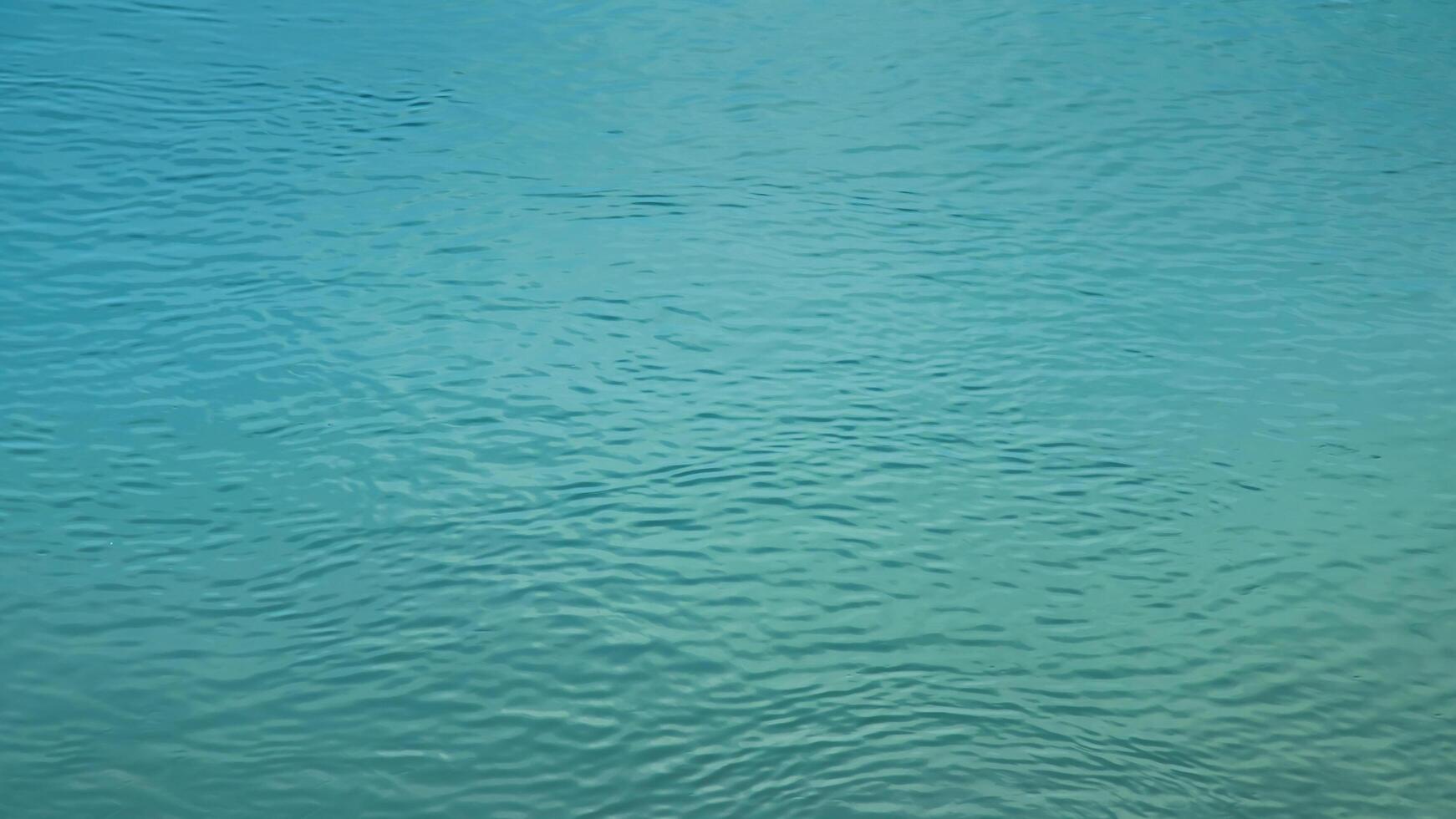 Background of the water surface of the Salzach river. Texture of water of a mountain river. photo