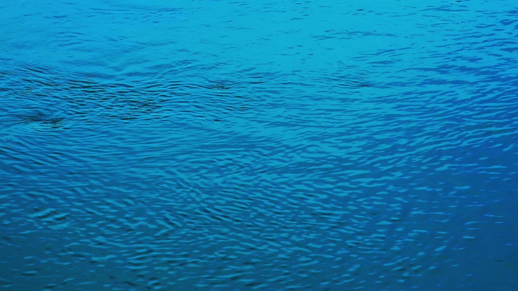 Background of the water surface of the Salzach river. Texture of water of a mountain river. photo