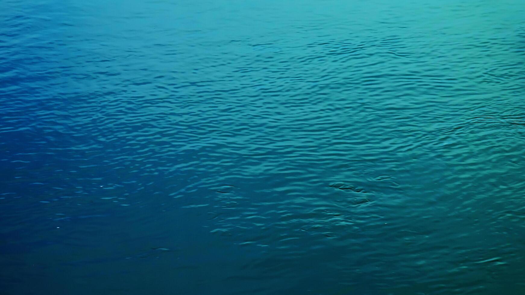 Background of the water surface of the Salzach river. Texture of water of a mountain river. photo