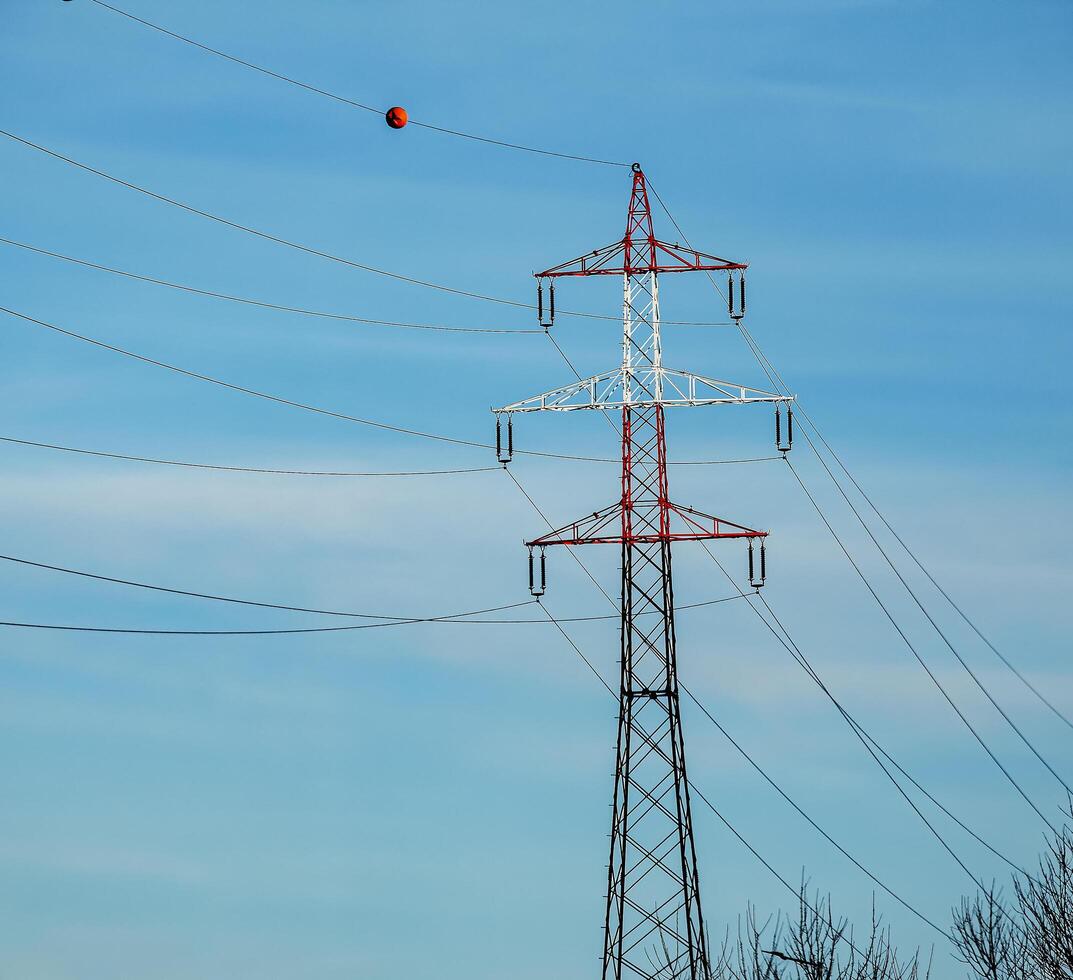 High voltage power lines along a road in Austria. photo