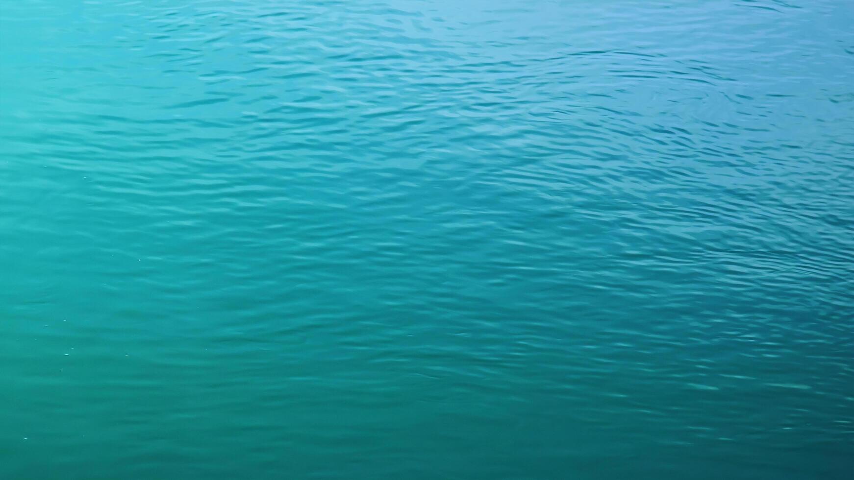 Background of the water surface of the Salzach river. Texture of water of a mountain river. photo