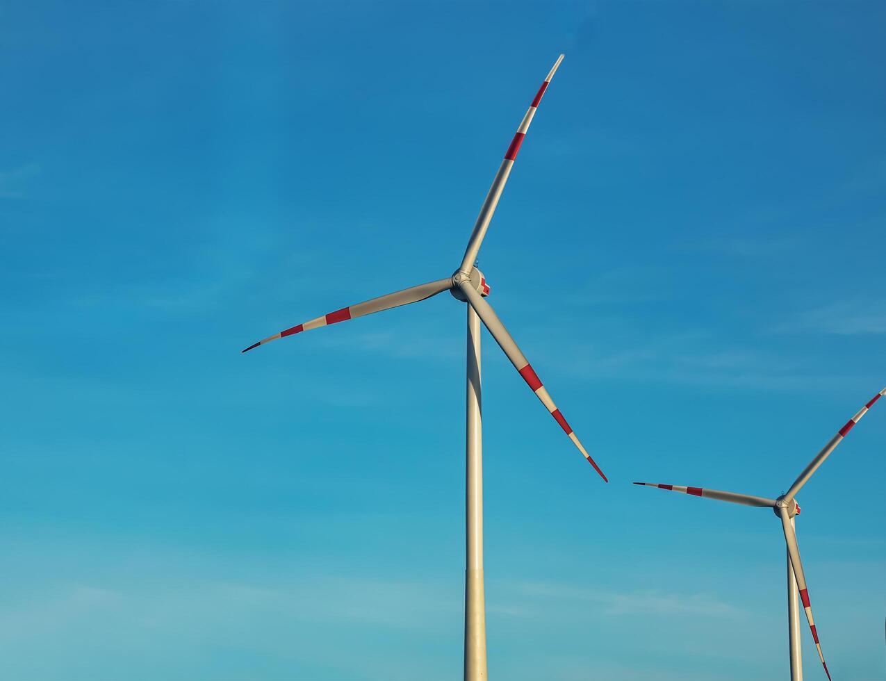 Wind farm park next to a road in Austria in sunny weather. photo