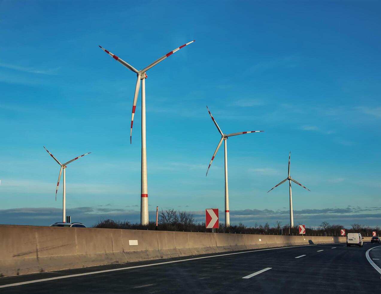 Wind farm park next to a road in Austria in sunny weather. photo