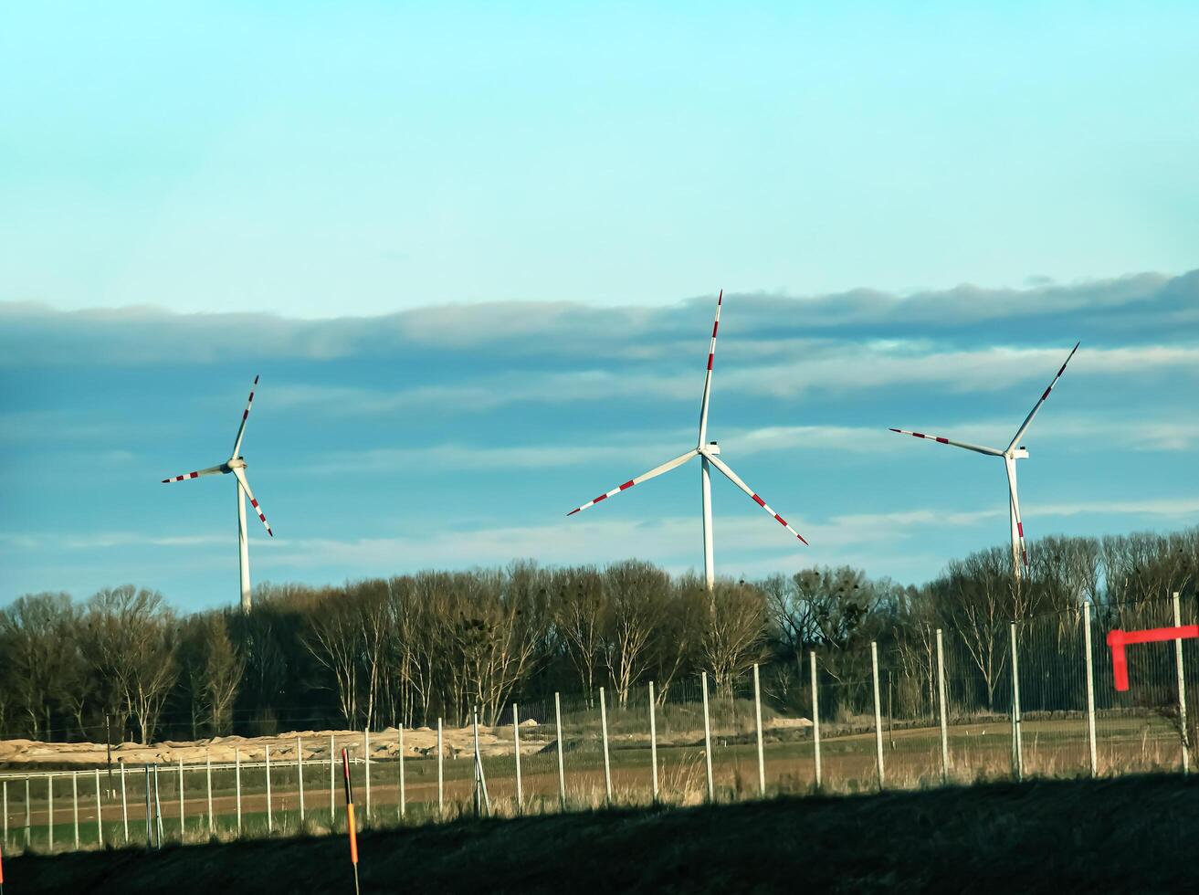 Wind farm park next to a road in Austria in sunny weather. photo