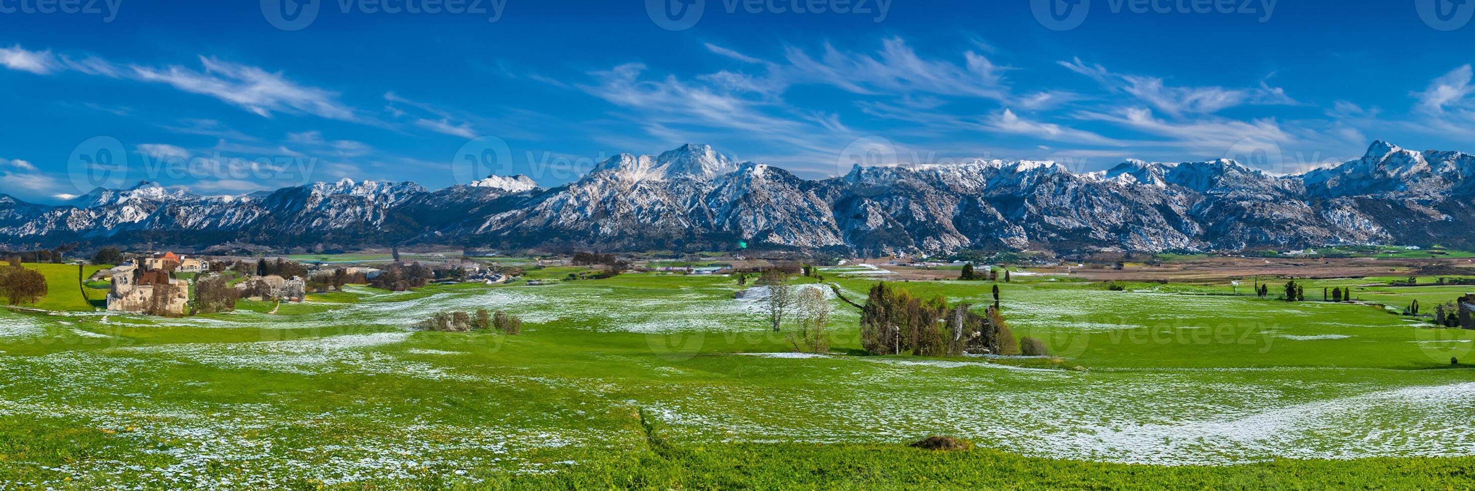 beautiful rural landscape in Bavaria with mountain range and meadow at springtime photo