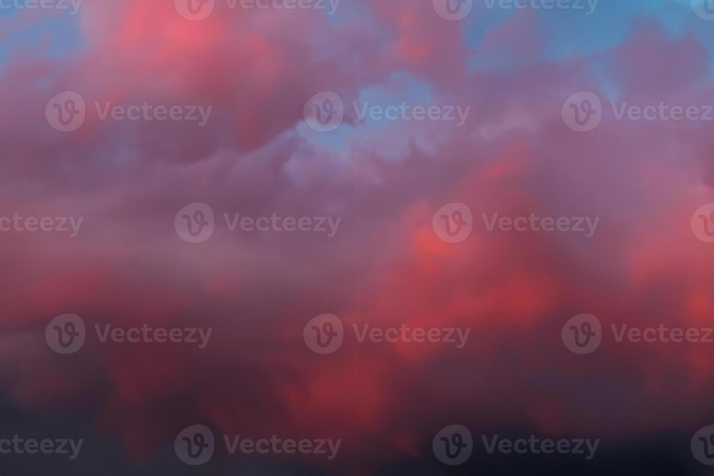 Dramatic sky with bright red and dark blue stormy clouds. Nature background photo