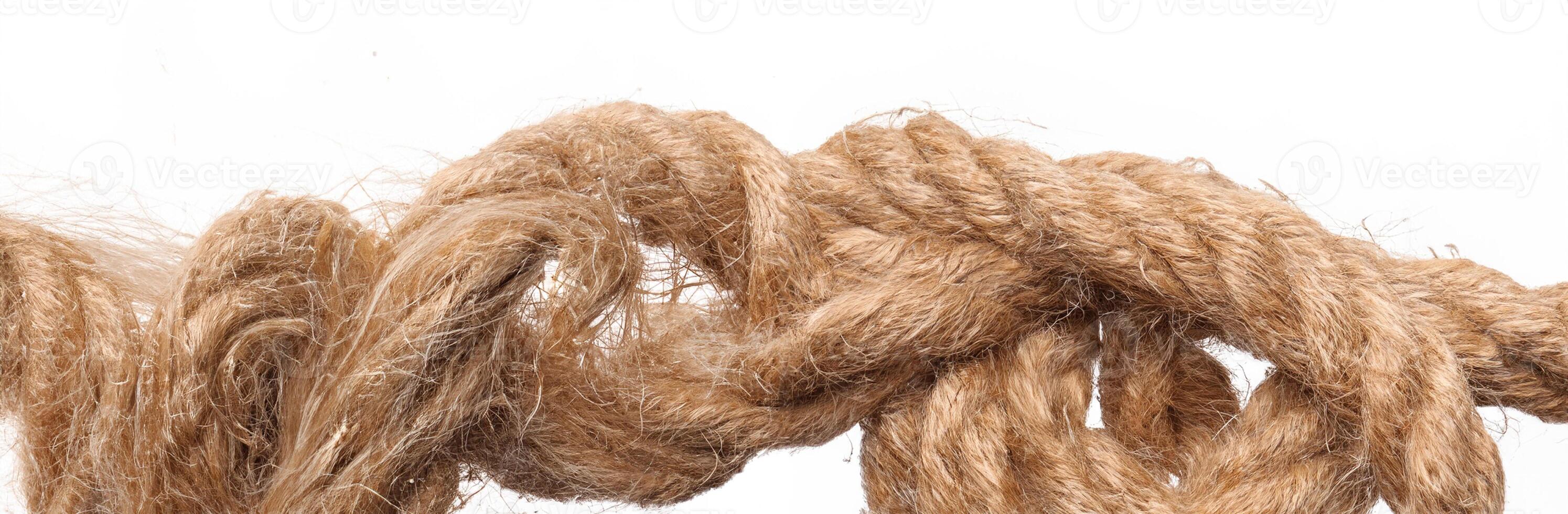 Rope with knot on white background photo