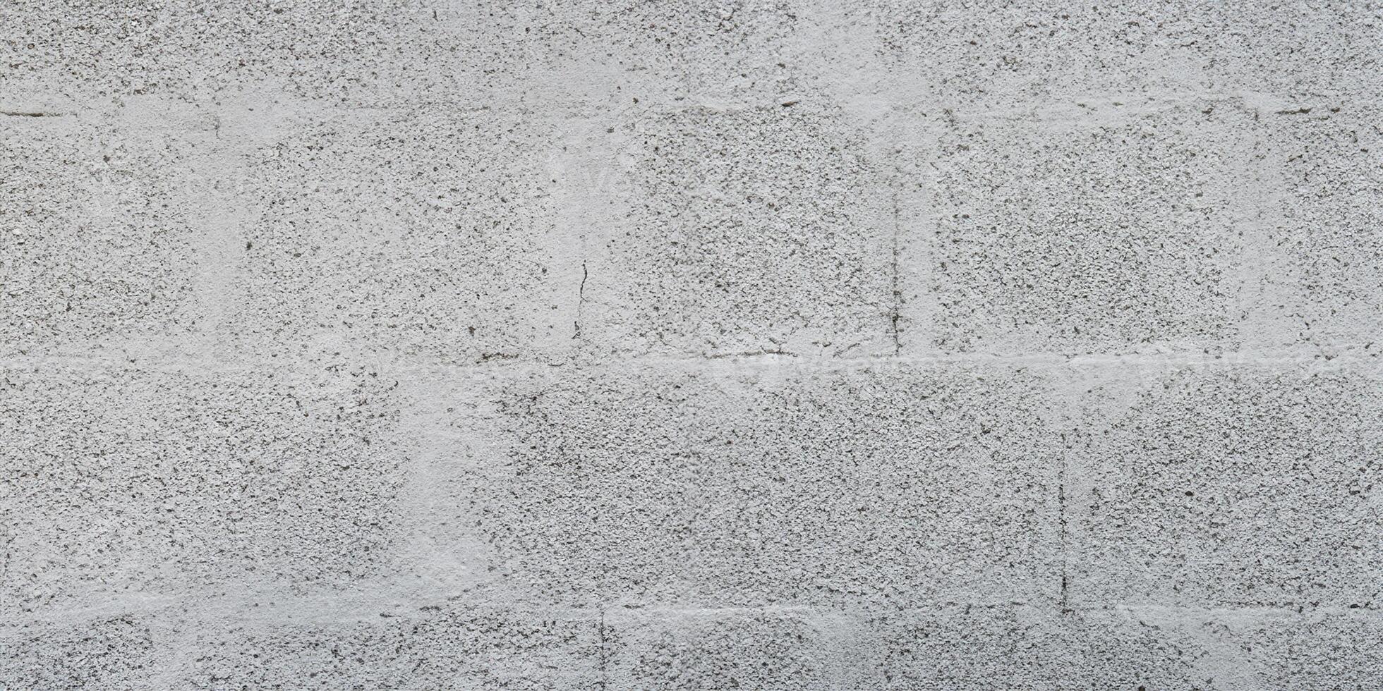 Grey brick cinder block wall background concrete tile cladding seamless texture photo