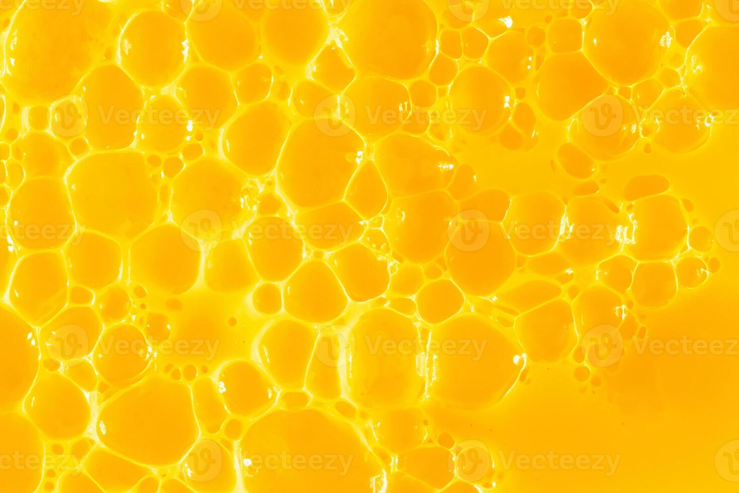 naranja jugo. burbuja amarillo textura antecedentes. baya gel a limpiar el piel de el cara y cuerpo. spa tratos, piel cuidado. bañera espuma, detergente. oro limo foto