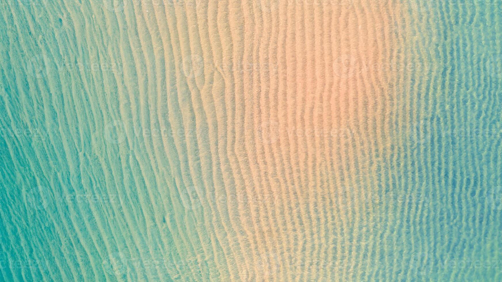 Aerial top view of Beach with shade emerald blue water and wave foam on tropical sea photo