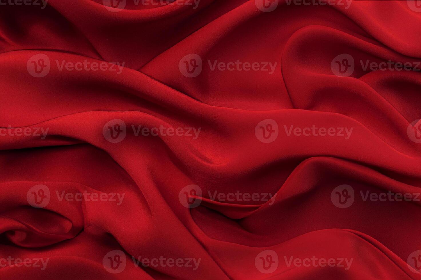 Close-up texture of natural red or pink fabric or cloth in same color. Fabric texture of natural cotton, silk or wool, or linen textile material. Red canvas background. photo