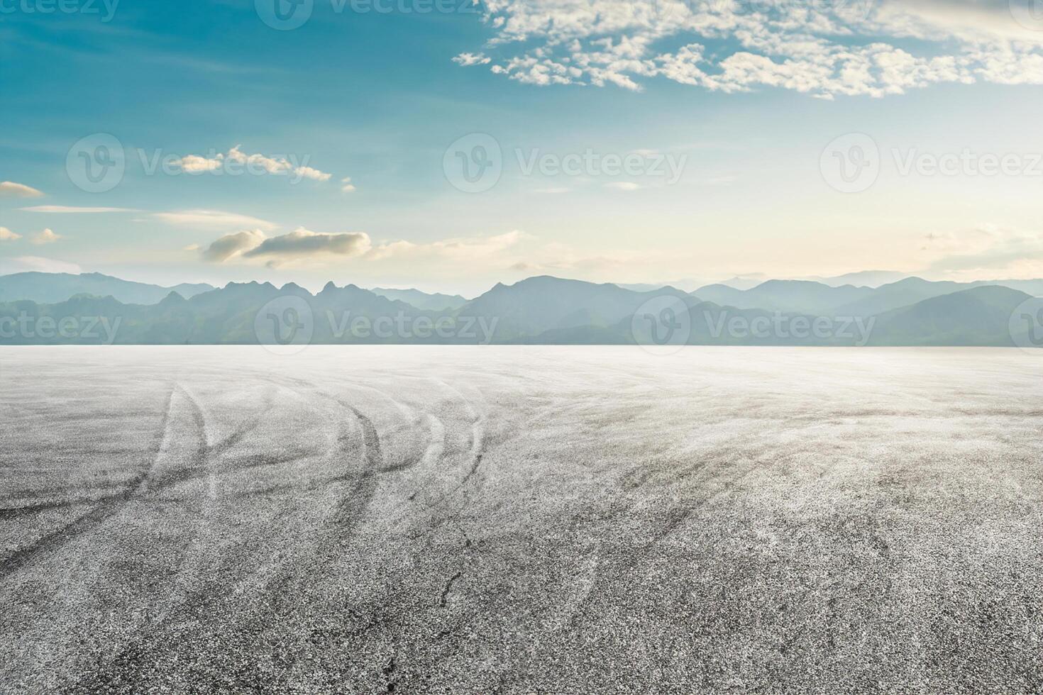 Asphalt race track ground and mountain with sunset clouds photo