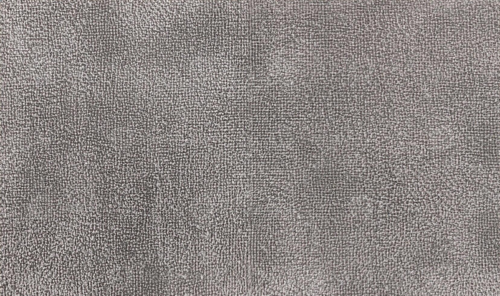 warmy grey towel texture for background. textile fabric consist of cotton fiber material. plush, fluffy, dry, soft and clean cloth background. photo