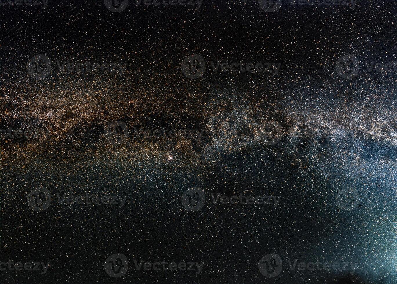 Night sky, many stars with milky way around Cepheus and Cygnus constellation, Andromeda galaxy visible in lower left corner. Long exposure stacked photo