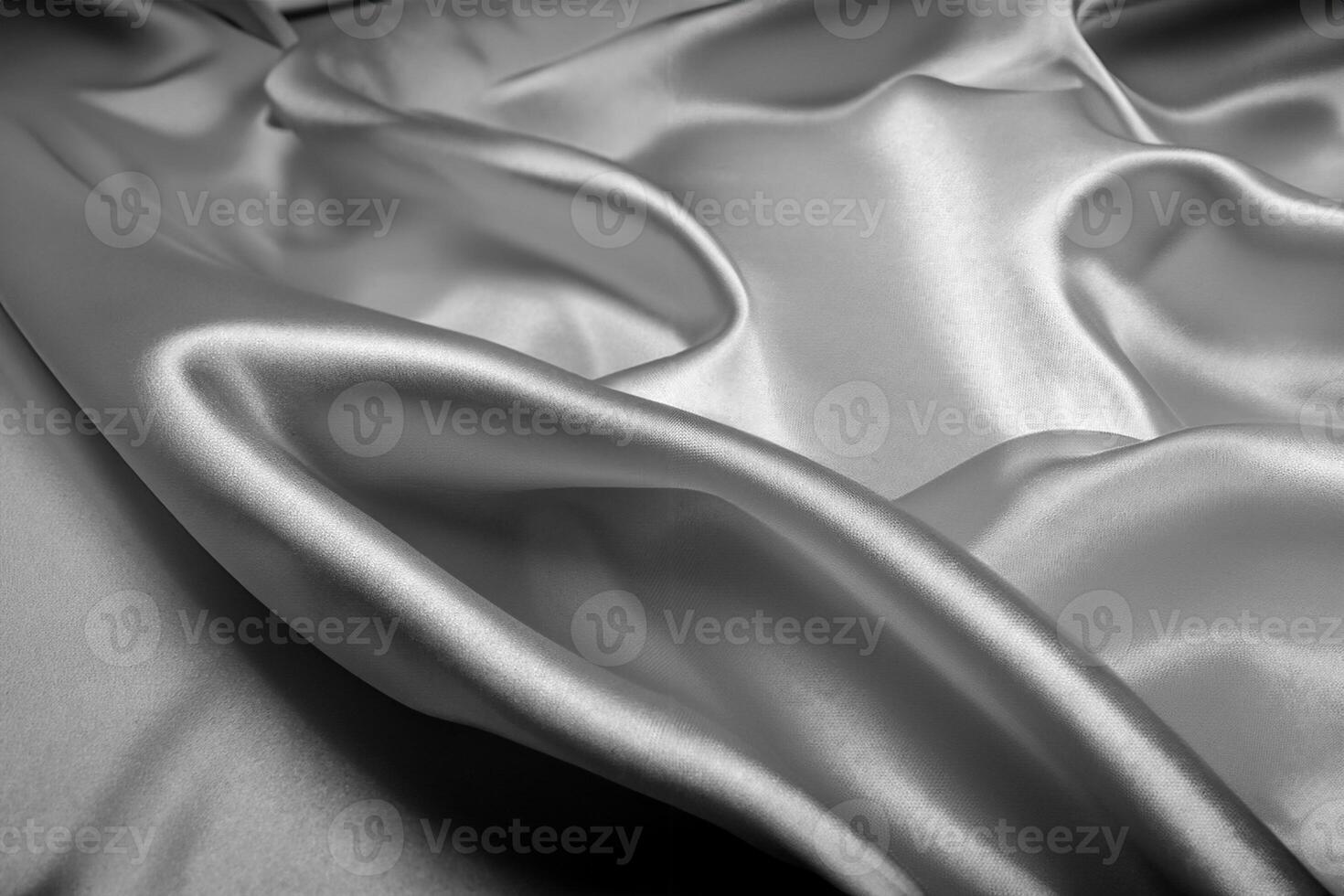 Black silk texture luxurious satin for abstract background. Dark tone of fabric photo
