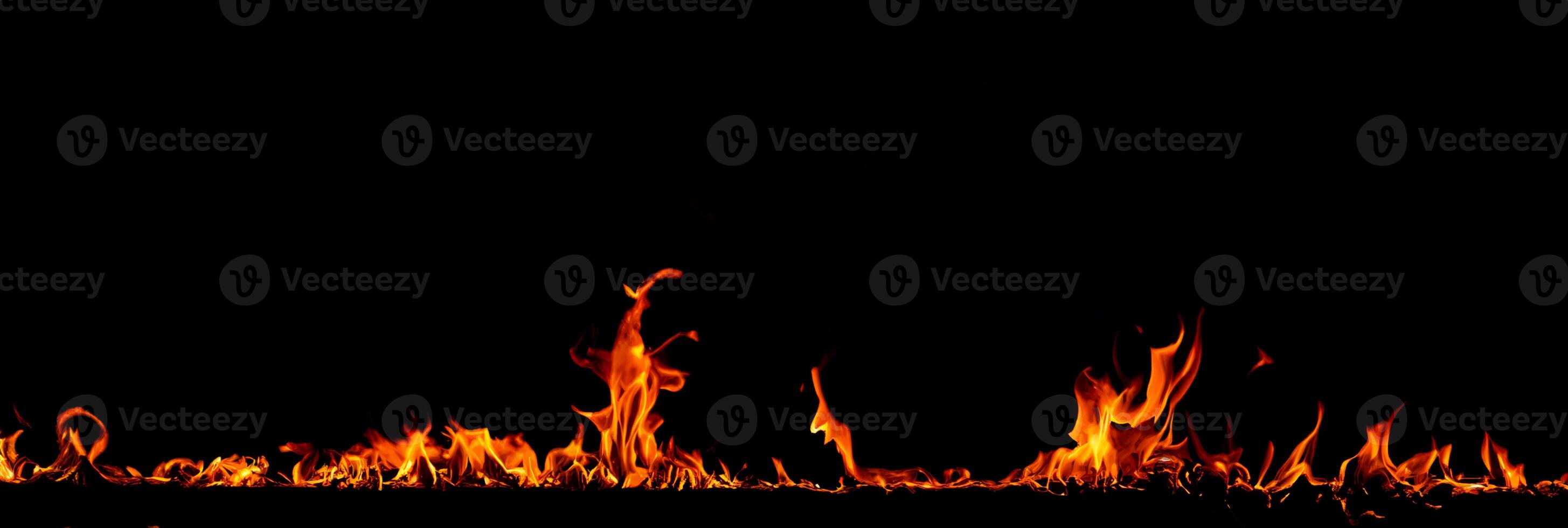 On fire flames at the black background photo