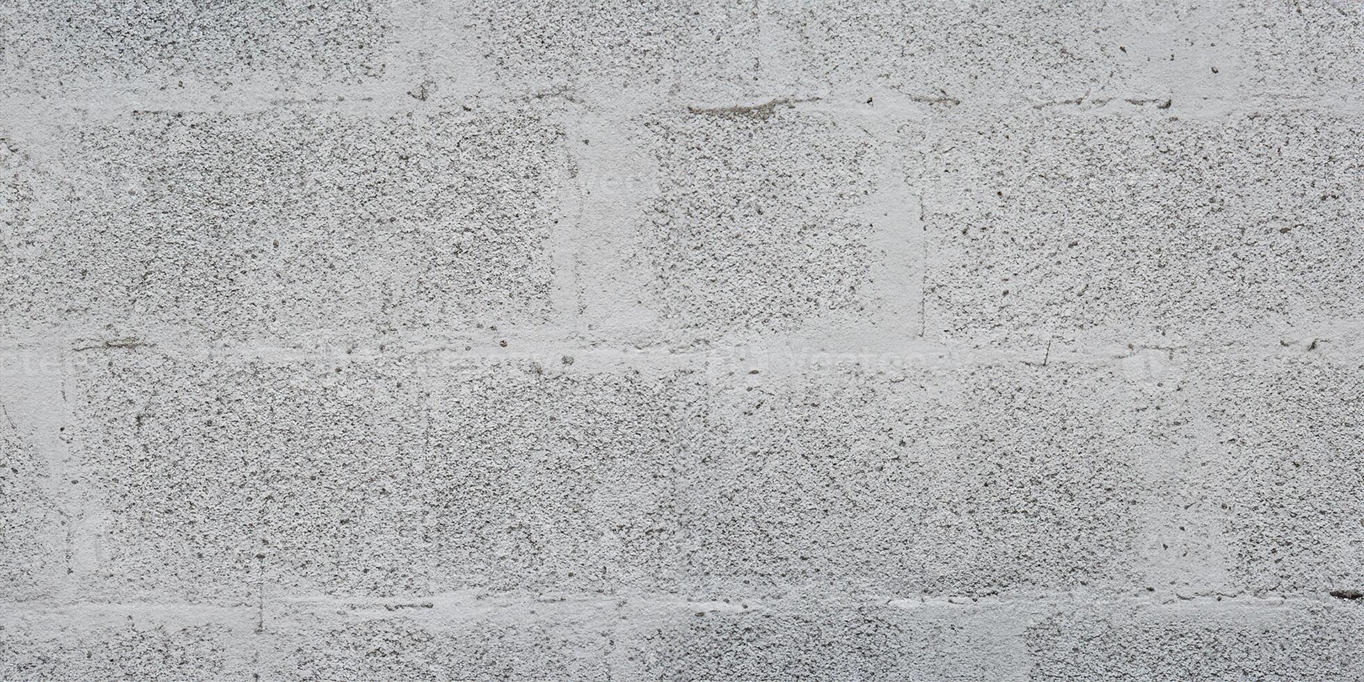 Grey brick cinder block wall background concrete tile cladding seamless texture photo