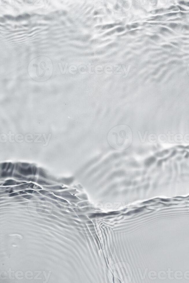 Texture of water on light background photo